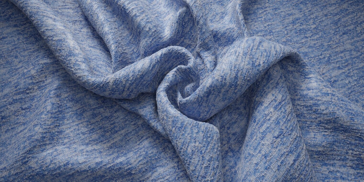 Folded blue textile with visible heathering and variations in shade across the surface.